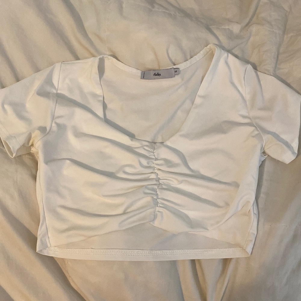 Adika touched white crop top in size small